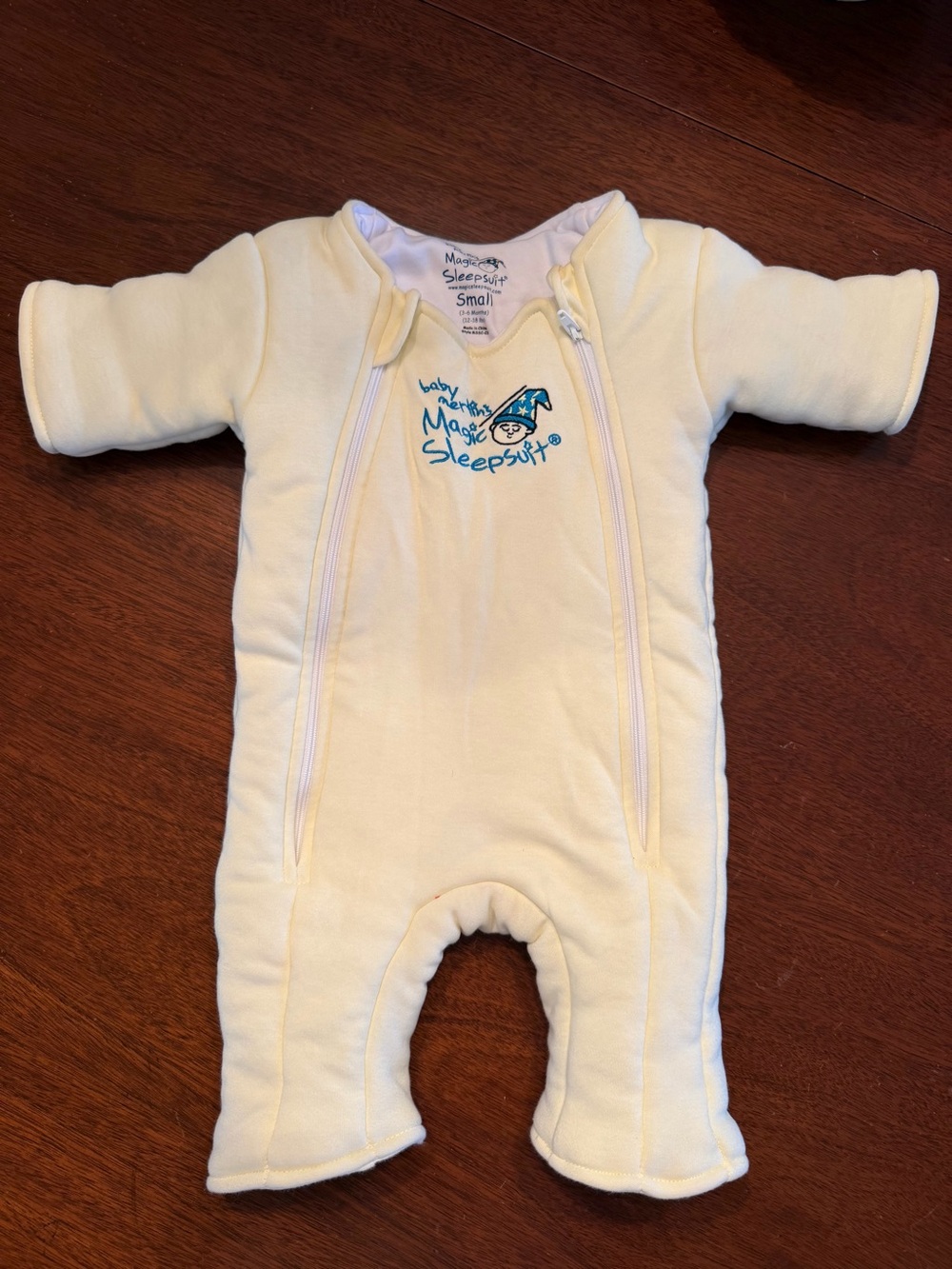 Magicsuit Baby One-Piece Footie in Soft Cream with Blue Logo